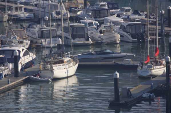 24 March 2020 - 09-03-13 
That sleek grey boat on the far side of the centre pontoon - that's Lexi, the new star of the river. A Princess R45 sports boat.

Princess sports boat R35 Lexi inDartmouth